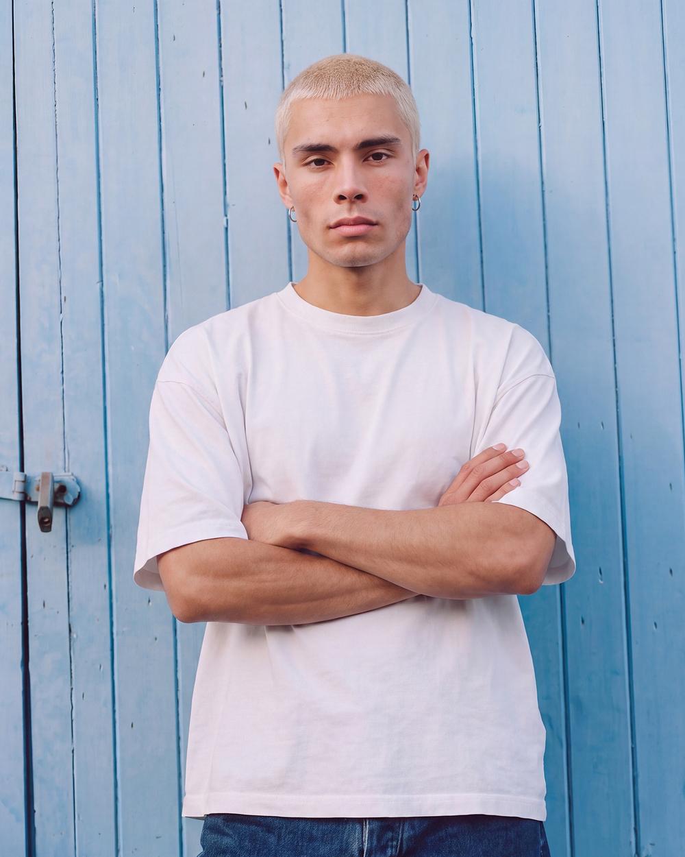 Blonde man, arms crossed